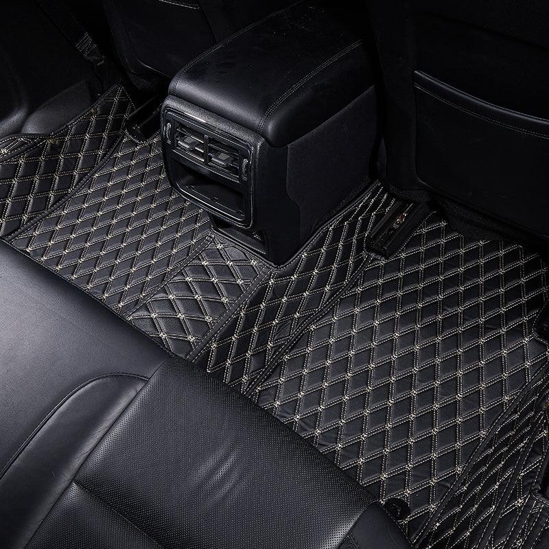 Luxury custom diamond-stitched car seat covers and floor mats in black leather