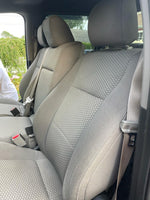 Ford F-150 front seats with premium custom gray seat covers installed